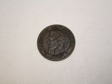 a close up of a coin on a table with a white background