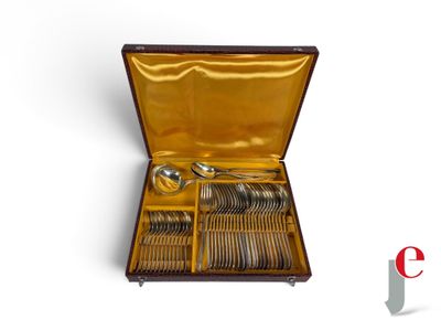 a box with silverware inside of it on a white surface
