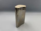 a silver lighter sitting on top of a white table