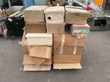 many boxes stacked on top of each other on the street