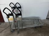 three luggage carts sitting next to each other on a cement floor
