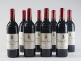 six bottles of red wine are lined up in a row