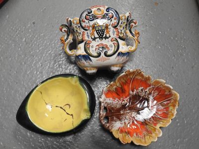 a small bowl of mustard and a small bowl of sauce on a table