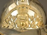 a gold helmet with a crest on it