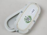 a small white box with a floral design on it