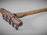 a close up of a wooden raket on a white surface