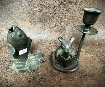 two candlesticks that are sitting next to each other