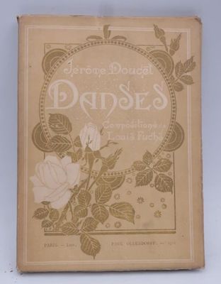 un vieux livre sur lequel figure l'image d'une rose et de feuilles