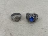 a couple of rings sitting on top of a white table