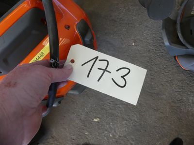 a person holding a sign with the number 473 on it