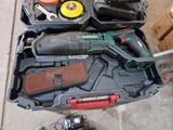 many tools in a tool box on the floor