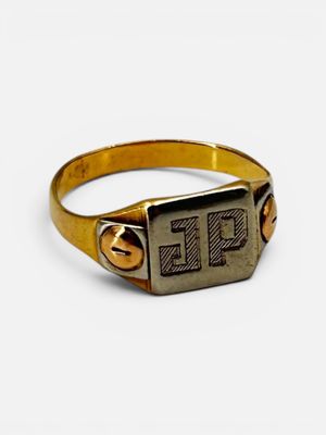 an image of a gold signet ring with the letter tl on it