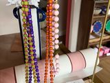 a display case with beads and a roll of paper