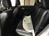 the back seats of a car with a tray in the back of it