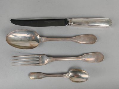 four spoons, a knife, and a fork on a table