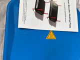 a blue box that has two electronic devices on top of it
