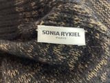 a close up of a sweater with a label on it