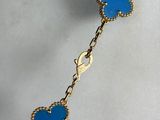 bracelet with blue enamel butterfly charms on a gold plated chain