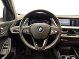 the interior of a bmw vehicle with a steering wheel and dashboard