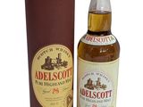 an image of a bottle of whisky next to a cardboard box