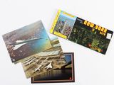 three postcards of a plane and a plane on a white surface