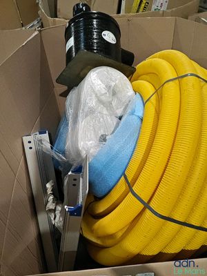 a cardboard box with a bunch of hoses in it