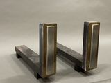 two metal bookends that are sitting on a table