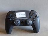 a video game controller sitting on the floor next to a wall