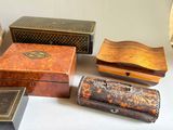many different types of wooden boxes on a table