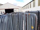 a fence that has a bunch of pipes attached to it