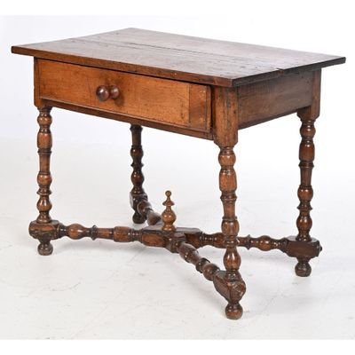 an old wooden table with a drawer on top of it