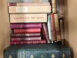a box full of books that are stacked on top of each other