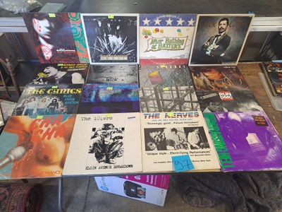 a lot of records on a table in a room