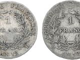 a silver coin with a wreath on the front and a laurel on the back