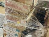 a large stack of boxes on a pallet in a warehouse