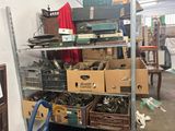 many boxes of assorted items on a shelf in a room
