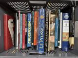 many books that are on a shelf in a book case