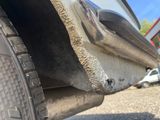 a close up of a car tire with a hole in it