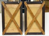 two wooden frames that are on a white table