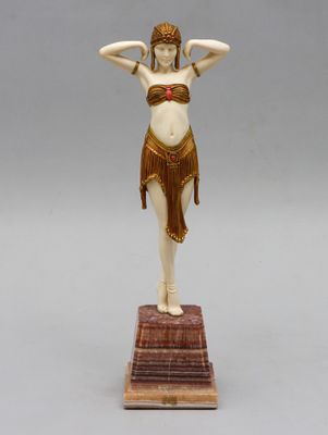 an art deco figurine of a woman in a bathing suit