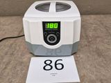 an image of a digital centrifuizer sitting on a table