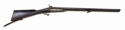 an old gun with a wooden barrel on a white background