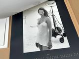 a picture of a woman in a white dress on a book