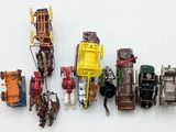 a lot of toy cars that are lined up on the wall