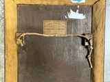 a picture of a wooden frame with a bird on it