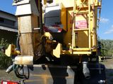 a truck that has a machine on the back of it