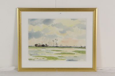 un tableau représentant un champ avec des arbres au loin et des nuages dans le ciel