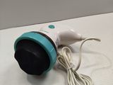 a white and blue hair dryer sitting on a table