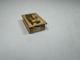 a small box with a picture on it on a table