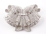 an image of a diamond bow broochle on a white background